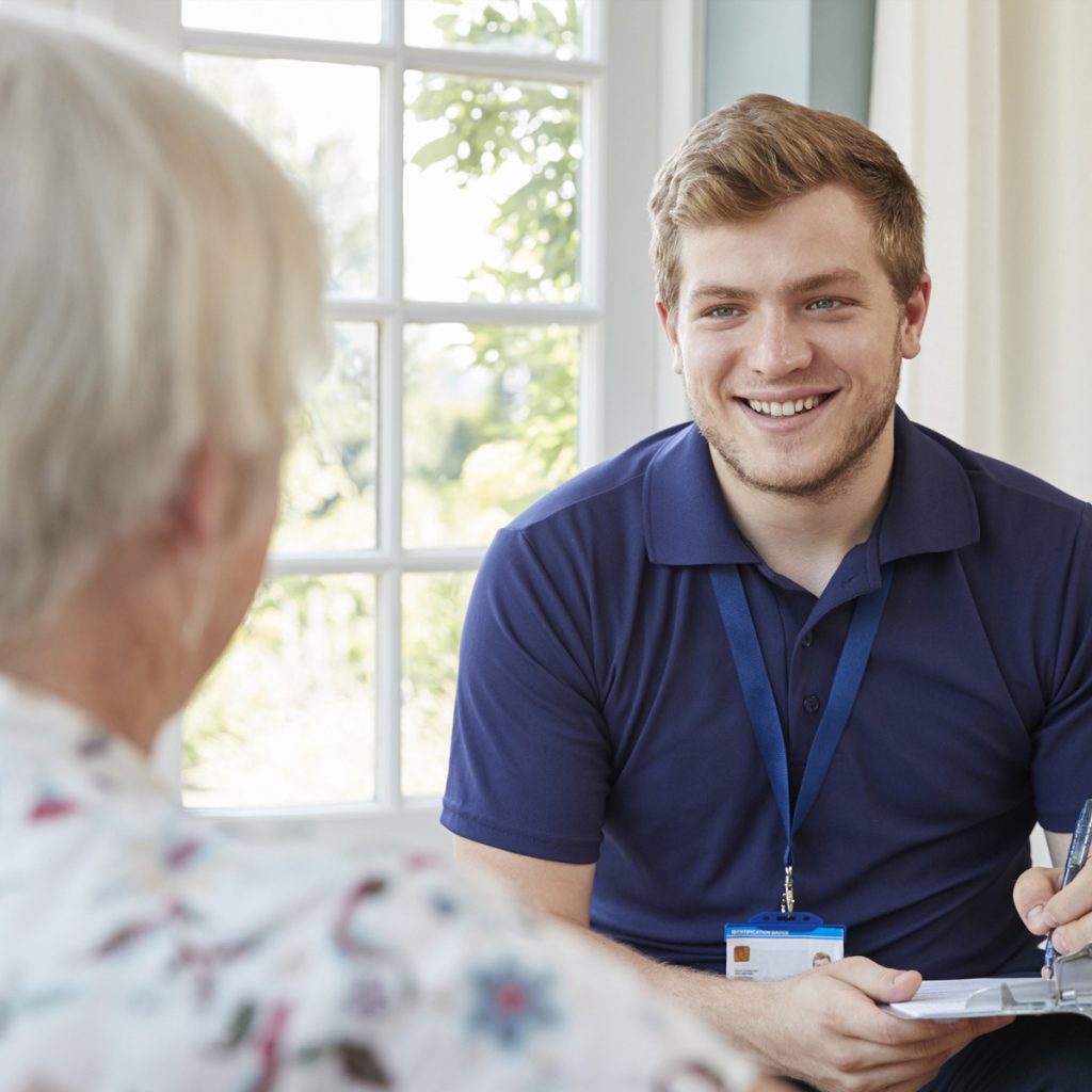 Sunny Vista Senior Living Community in Colorado Springs, CO - sunny vista caregiver providing information to senior woman