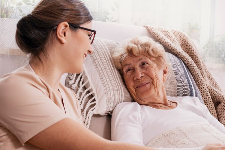 Sunny Vista Senior Living Community in Colorado Springs, CO - sunny vista female caregiver with senior woman