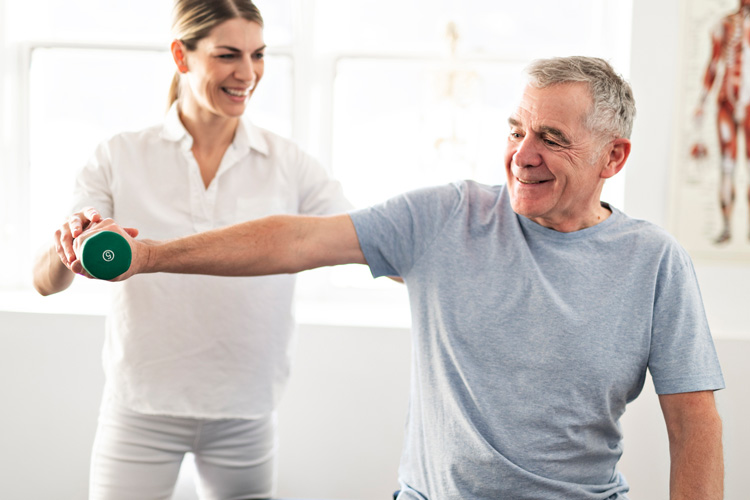 Sunny Vista Senior Living Community in Colorado Springs, CO - sunny vista senior man doing physical therapy with female therapist