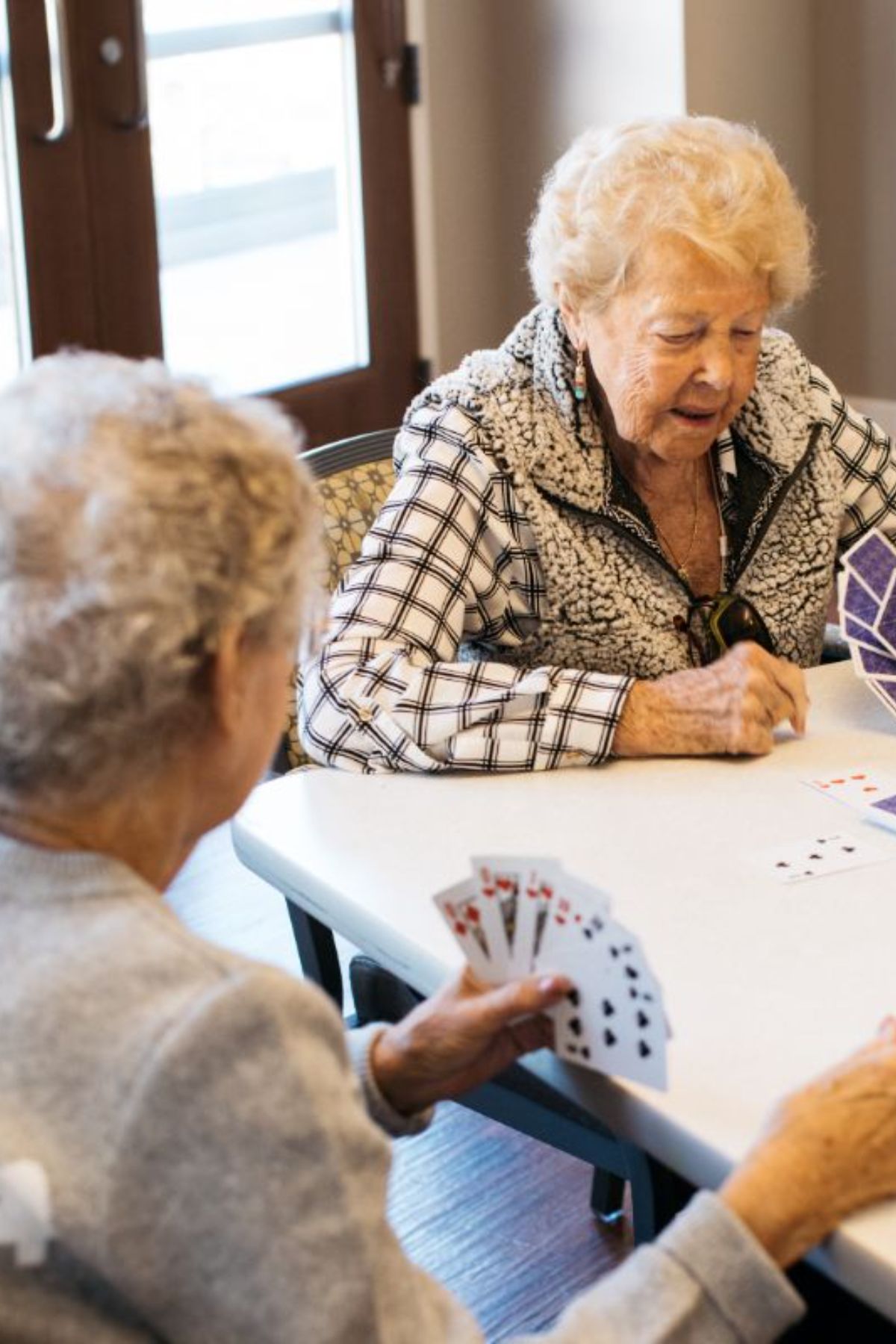 Sunny Vista Senior Living Community in Colorado Springs, CO - ther retreat residents playing cards square