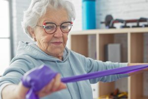 Sunny Vista Senior Living Community in Colorado Springs, CO - sunny vista senior woman with exercise band