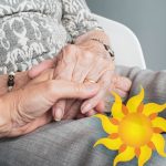 Sunny Vista Senior Living Community in Colorado Springs, CO - sunny vista caregiver holding hand of senior woman