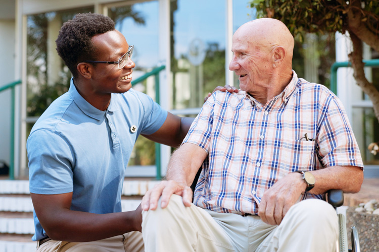 sunny vista male caregiver with senior adult man in wheelchair Sunny Vista Senior Living Community in Colorado Springs, CO - sunny vista male caregiver with senior adult man in wheelchair