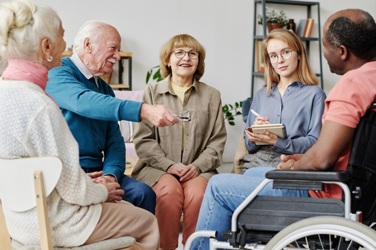sunny vista group of seniors discussing a topic Sunny Vista Senior Living Community in Colorado Springs, CO - sunny vista group of seniors discussing a topic