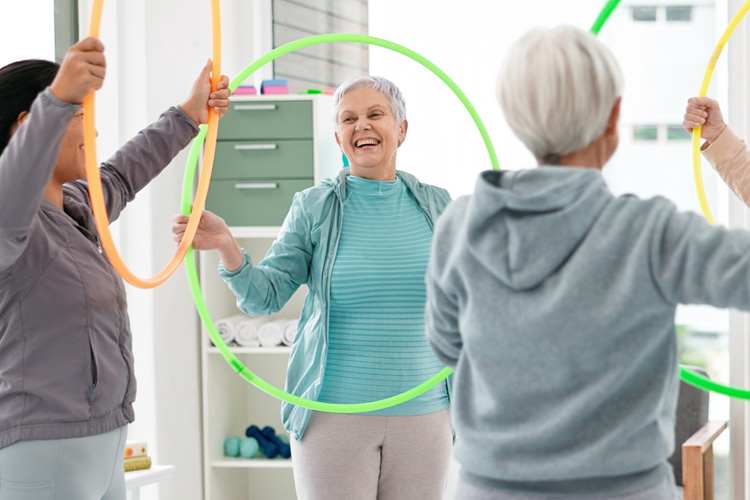 sunny vista senior group exercising with hula hoops Sunny Vista Senior Living Community in Colorado Springs, CO - sunny vista senior group exercising with hula hoops