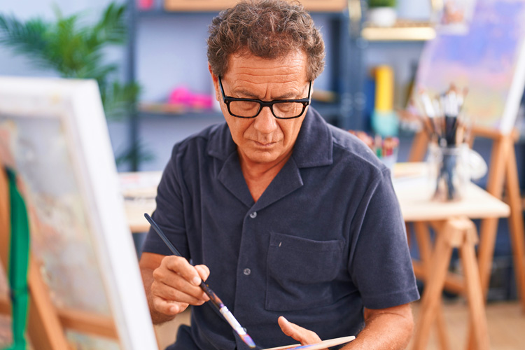 sunny vista senior man painting on canvas Sunny Vista Senior Living Community in Colorado Springs, CO - sunny vista senior man painting on canvas